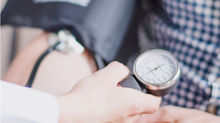 Clinician taking a patient's blood pressure