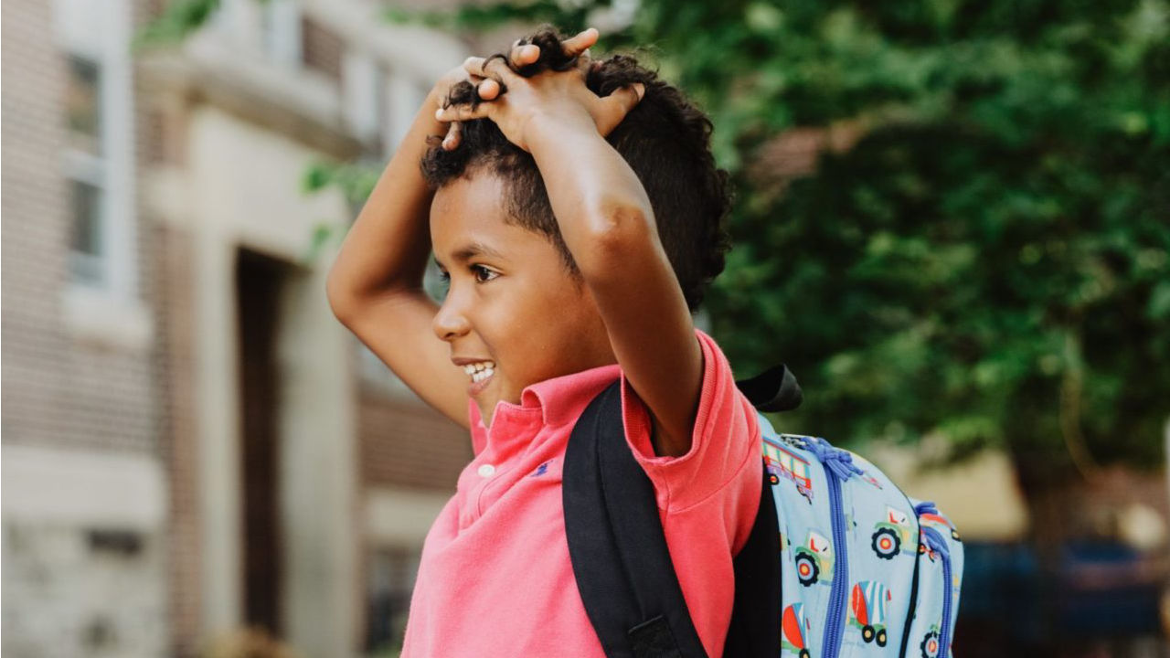 Child walking to school with a backpack